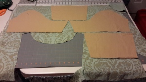 Cutting out sleeves after bodice back got a centered motif
